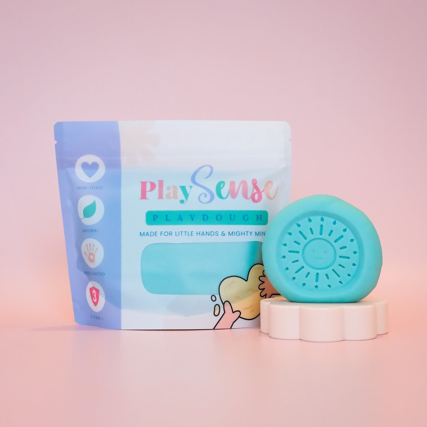 PlaySense playdough packaging with a blue playdough ball on a pink background