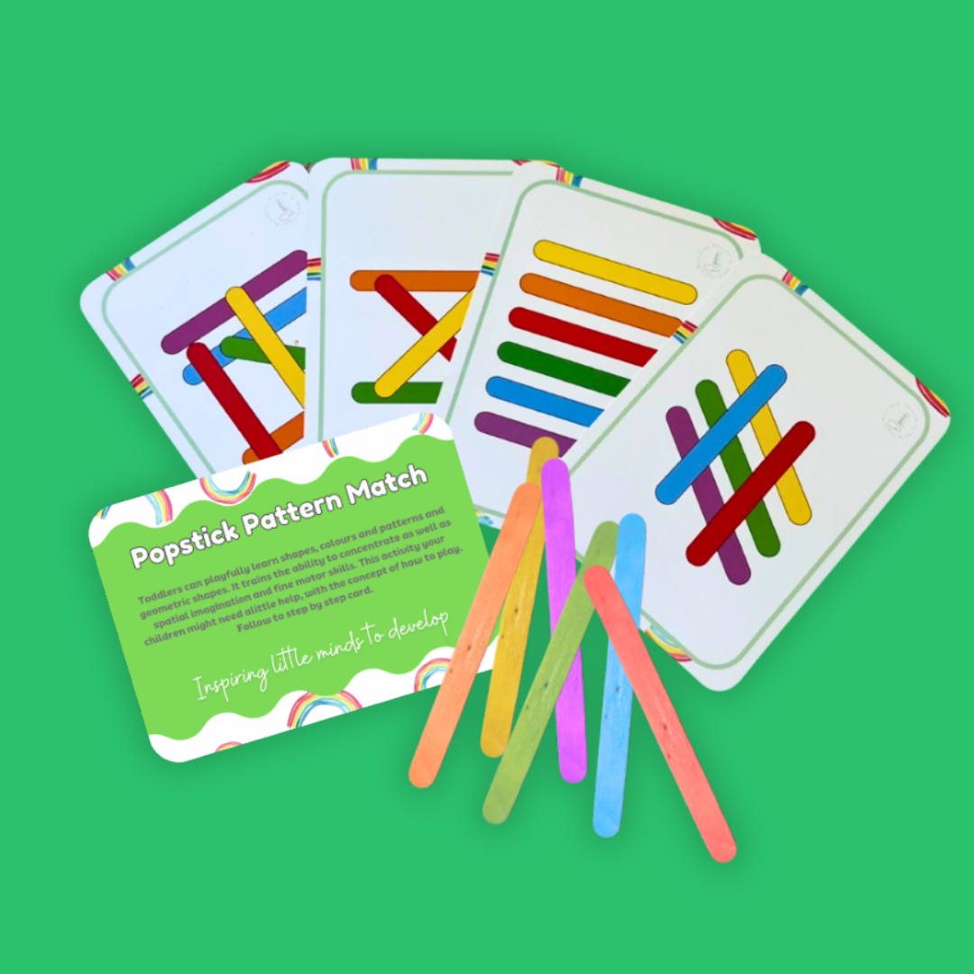 Educational game with pattern matching cards and colorful sticks on a green background