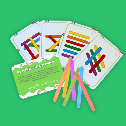 Educational game with pattern matching cards and colorful sticks on a green background