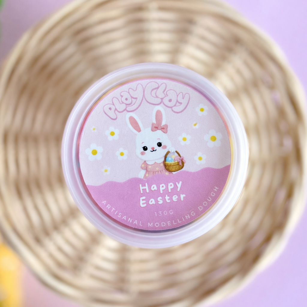 Modeling dough container with 'Happy Easter' design on a pink background